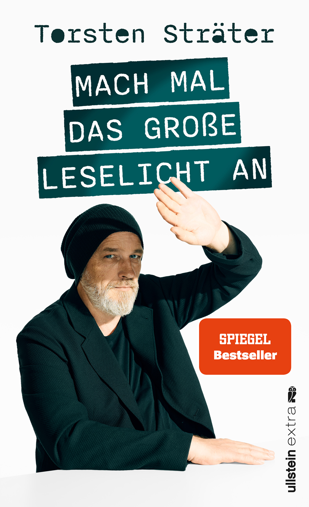 Cover von „Mach mal das große Leselicht an“: bärtiger Mann mit Beanie hebt Arm, weißer Hintergrund, Titel in grünen Balken.